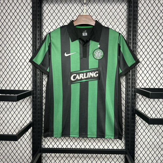 Celtic FC 2006-07 away shirt by Nike, green and black vertical stripes, Carling sponsor, displayed on a hanger.