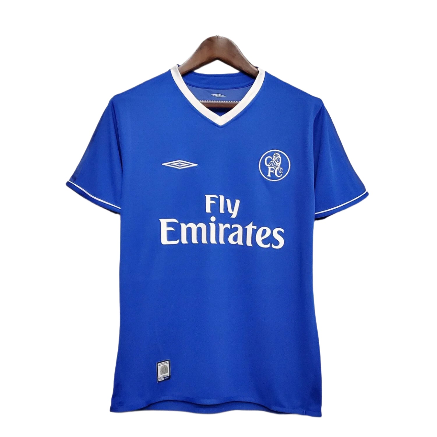 Blue Chelsea FC 2003 football shirt with white Fly Emirates sponsor logo, Umbro logo, and retro circular club crest