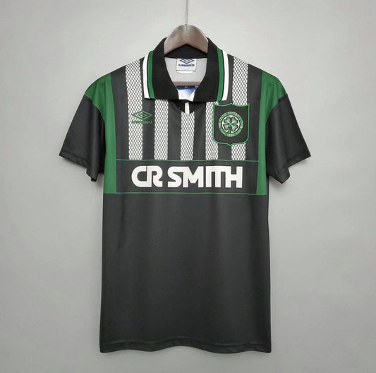 Full view of a vintage 94 Celtic FC away football shirt by Umbro, featuring black and white stripes, green sleeves, and CR Smith sponsor.