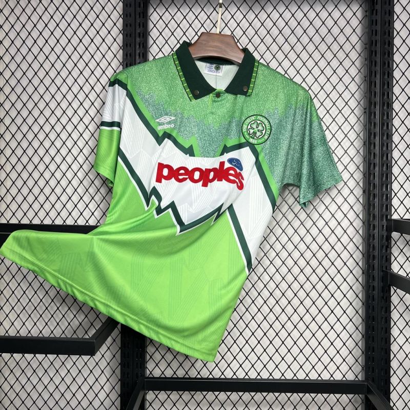 Celtic FC 1991-1992 away football shirt by Umbro with zig-zag design and "peoples" Ford sponsor, displayed on a hanger at an angle.