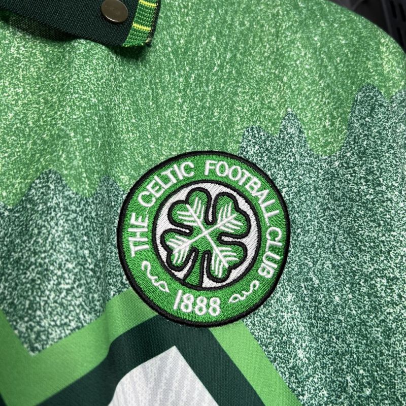 Close-up of the embroidered Celtic FC club badge on the 1991-1992 away shirt, showing the four-leaf clover and "The Celtic Football Club 1888" text.