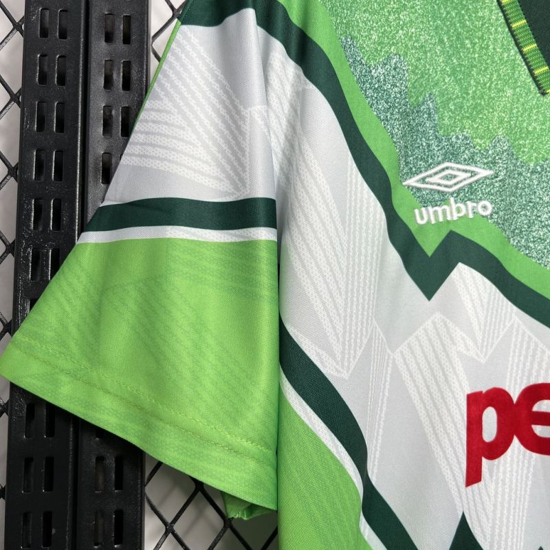 Close-up of the left sleeve and Umbro logo on the Celtic FC 1991-1992 away shirt, highlighting the green and white pattern and fabric texture.